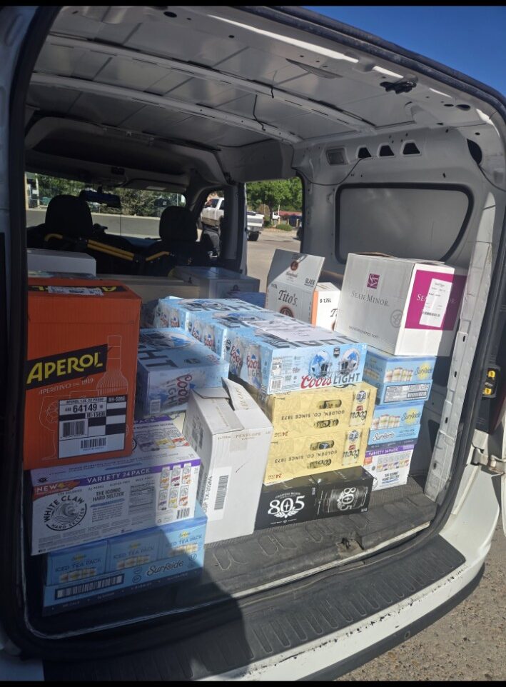 Retail beverage shipment loaded for courier delivery