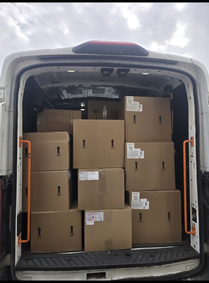 Courier van filled with boxed freight