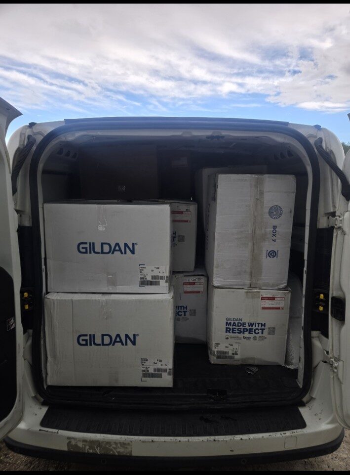 Large apparel shipment loaded into courier van